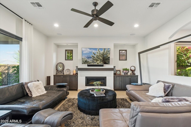 15711 S 11th Ave, Phoenix, AZ 85045 - living area featuring recessed lighting, ceiling fan, and a glass covered fireplace
