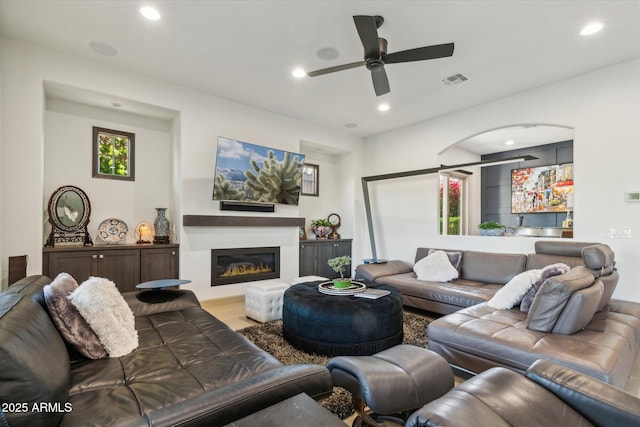 15711 S 11th Ave, Phoenix, AZ 85045 - living area featuring ceiling fan, recessed lighting, bar area, and a glass covered fireplace