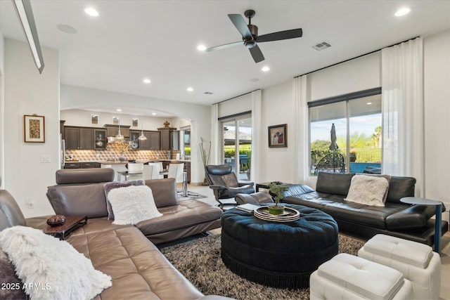 15711 S 11th Ave, Phoenix, AZ 85045 - living area with arched walkways, recessed lighting, and ceiling fan