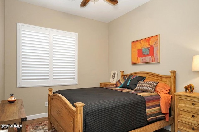 bedroom with hardwood / wood-style flooring and ceiling fan