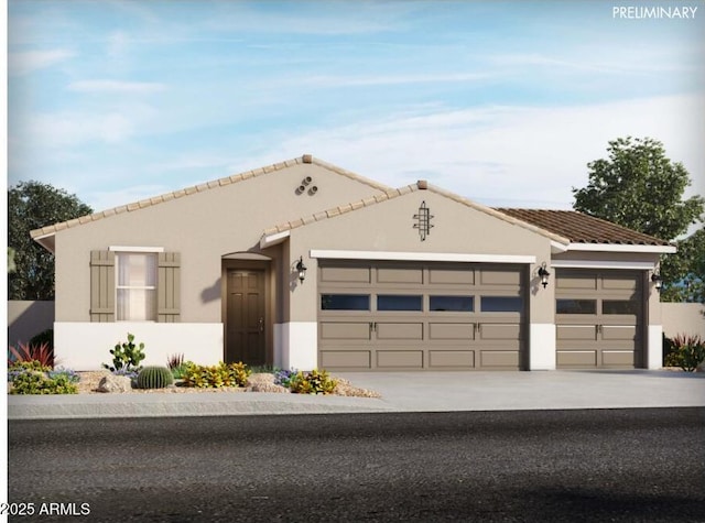 view of front of house featuring an attached garage, driveway, a tiled roof, and stucco siding