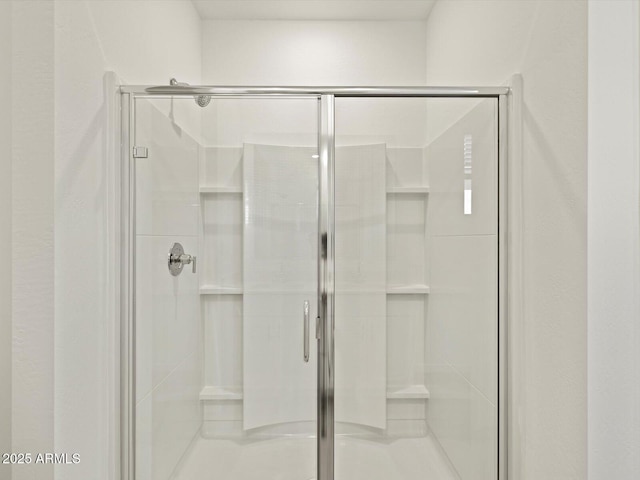 full bath with a shower stall