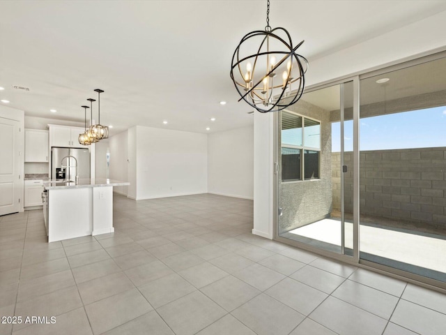 unfurnished dining area with light tile patterned floors, an inviting chandelier, baseboards, visible vents, and recessed lighting