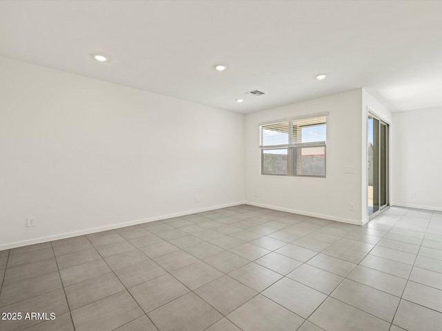 unfurnished room with baseboards, recessed lighting, visible vents, and light tile patterned floors