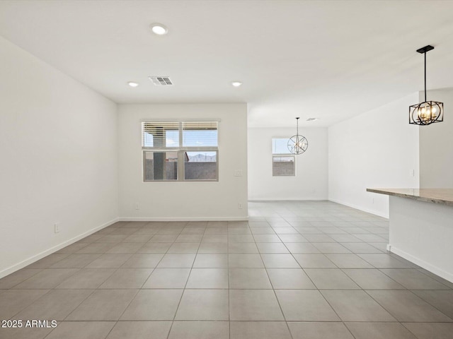 interior space featuring baseboards, an inviting chandelier, visible vents, and recessed lighting