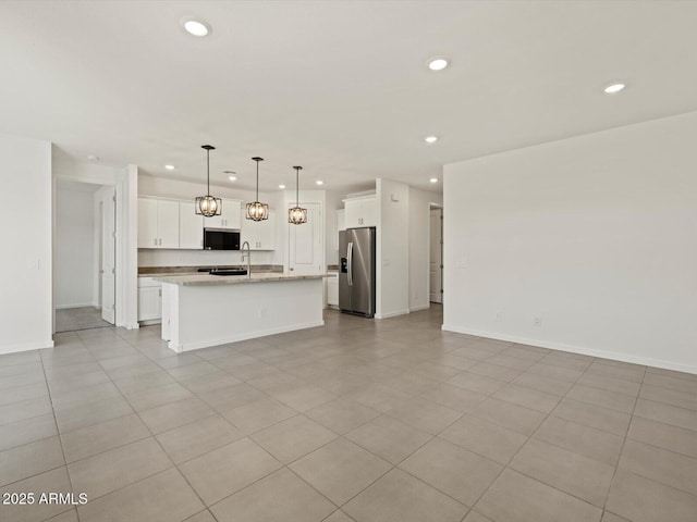 interior space featuring recessed lighting and baseboards