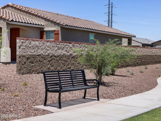 view of community with fence