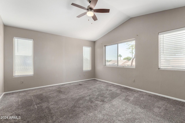 empty room with ceiling fan, carpet, and lofted ceiling