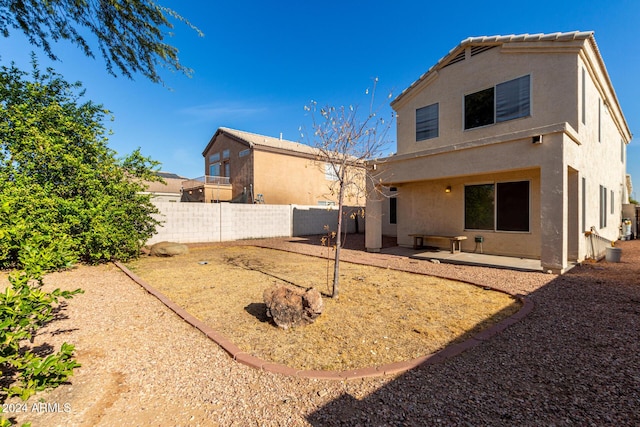 rear view of house with a patio