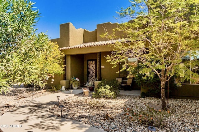 view of adobe home