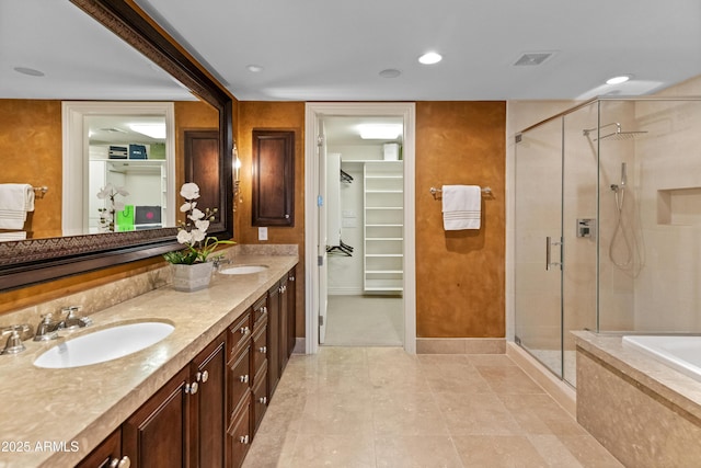 bathroom with vanity and separate shower and tub