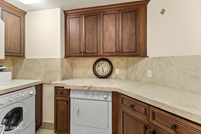 kitchen featuring washer / dryer and tasteful backsplash