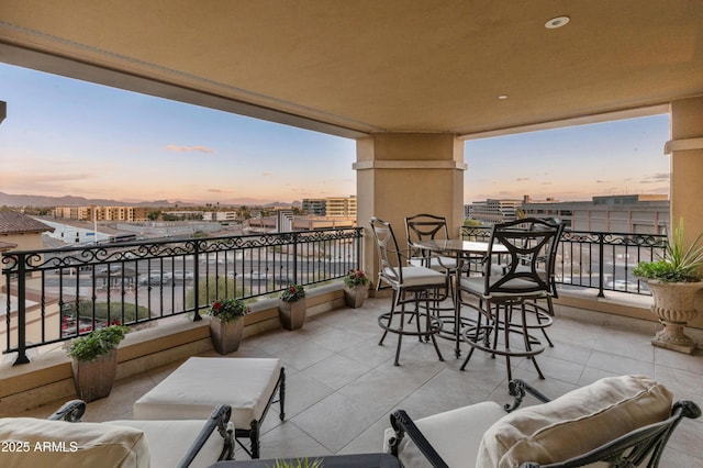 view of balcony at dusk