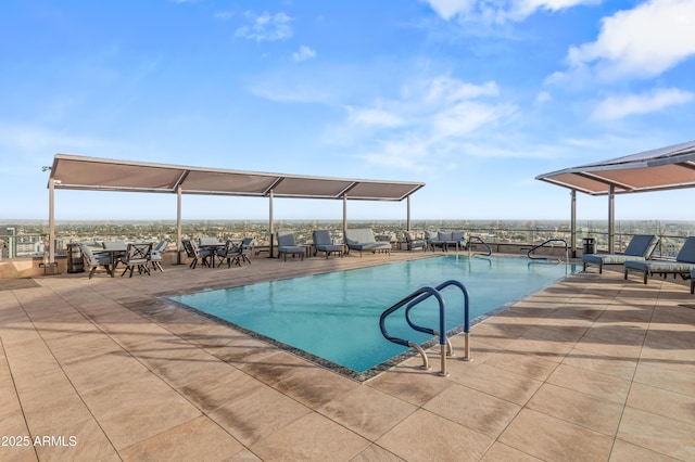 view of pool featuring a patio