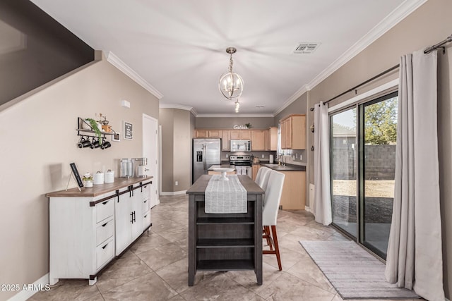 tiled dining space featuring sink, a notable chandelier, and ornamental molding