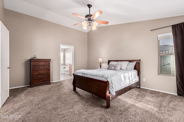 bedroom featuring lofted ceiling, ensuite bath, ceiling fan, and carpet flooring