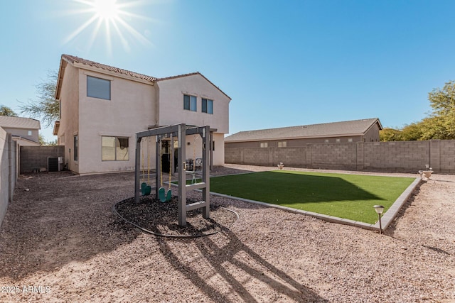 rear view of house with a lawn, central AC, and a pergola