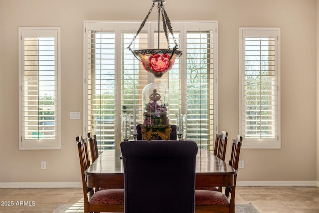 dining area featuring baseboards