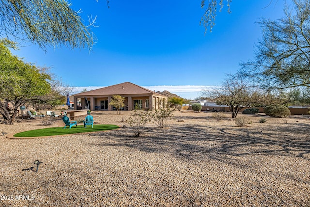 rear view of house with a patio