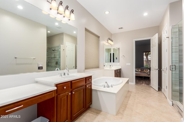5607 W Alyssa Ln, Phoenix, AZ 85083 - full bathroom with a stall shower, two vanities, a garden tub, and recessed lighting
