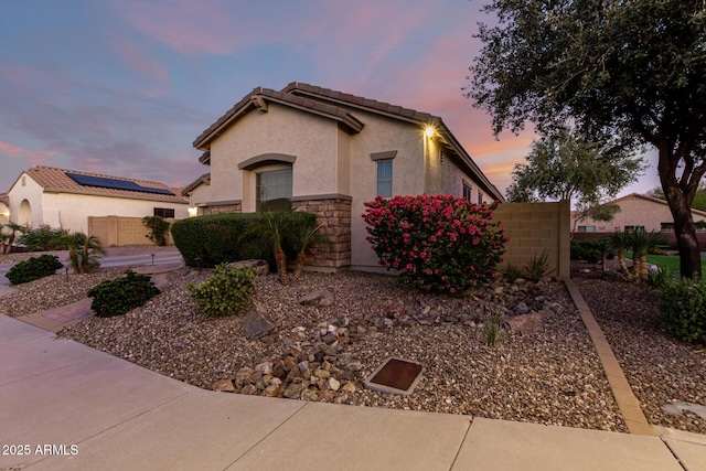 5607 W Alyssa Ln, Phoenix, AZ 85083 - view of front of home featuring stucco siding, a tile roof, and stone siding