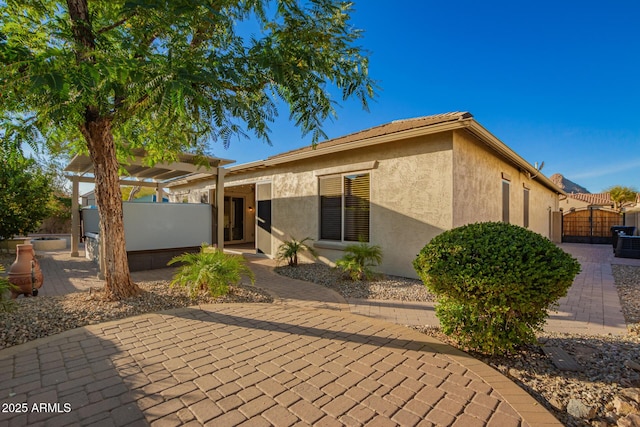 5607 W Alyssa Ln, Phoenix, AZ 85083 - view of front of house featuring a patio area, stucco siding, a gate, and a pergola