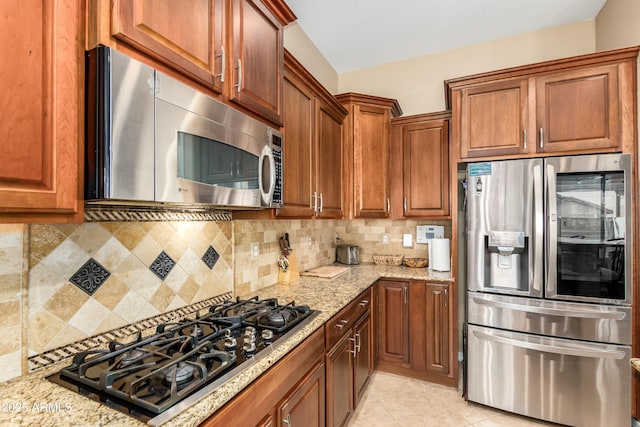 5607 W Alyssa Ln, Phoenix, AZ 85083 - kitchen with stainless steel appliances, light stone counters, and tasteful backsplash