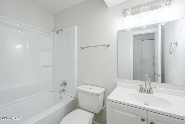 bathroom with bathing tub / shower combination, vanity, and toilet