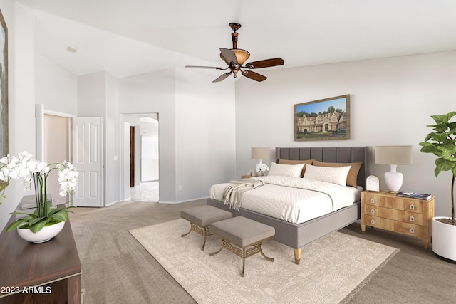 carpeted bedroom featuring ceiling fan and vaulted ceiling