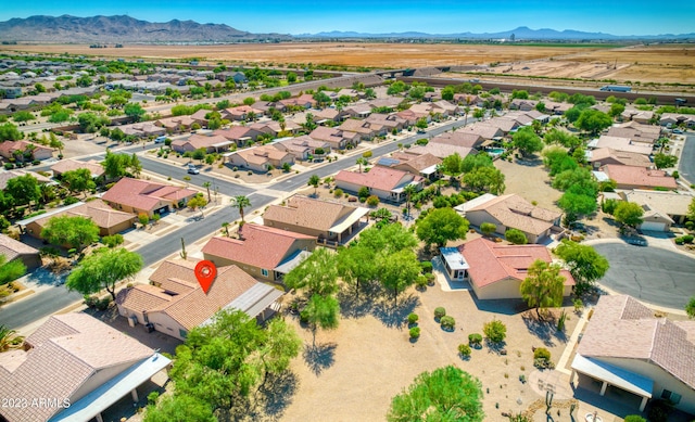 birds eye view of property with a mountain view