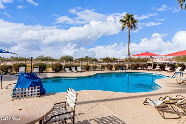 view of swimming pool featuring a patio