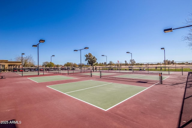 view of sport court featuring basketball hoop