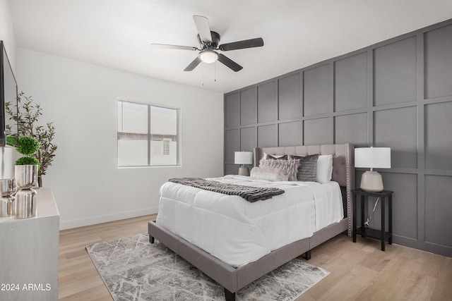 bedroom featuring light hardwood / wood-style flooring and ceiling fan