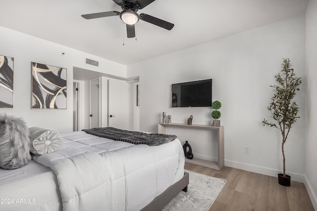 bedroom featuring light wood-type flooring and ceiling fan