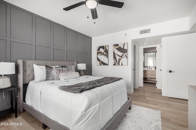 bedroom featuring light hardwood / wood-style flooring and ceiling fan