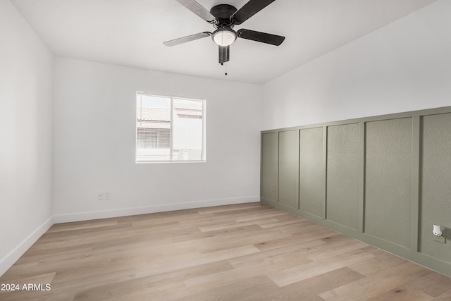 unfurnished room with light hardwood / wood-style flooring and ceiling fan