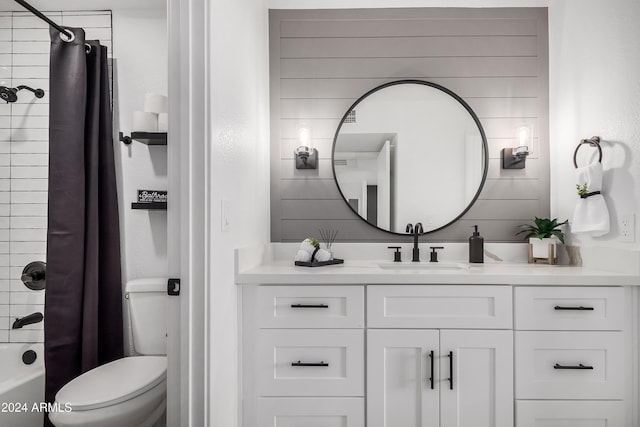 full bathroom with shower / bath combo with shower curtain, vanity, and toilet