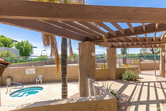 view of patio with a community hot tub and a pergola