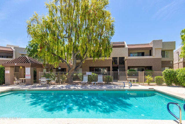 view of swimming pool with a patio