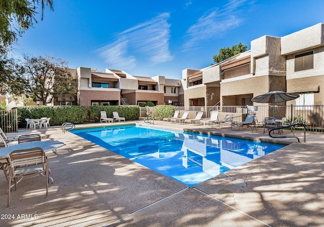 view of swimming pool featuring a patio