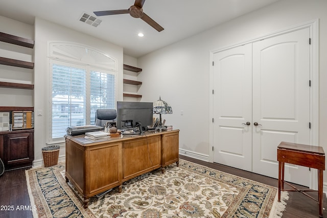 office area with ceiling fan and dark hardwood / wood-style floors