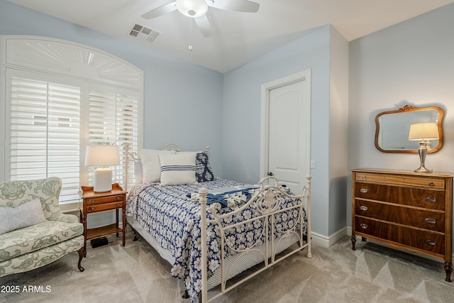 bedroom with ceiling fan and light carpet