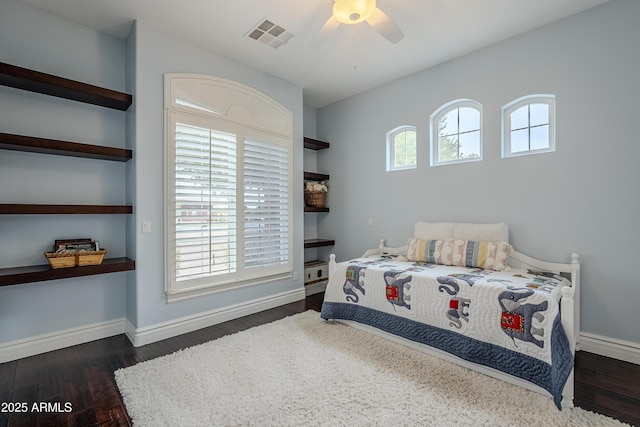 bedroom with multiple windows, ceiling fan, and dark hardwood / wood-style floors