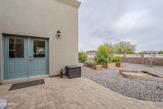 doorway to property featuring a patio area