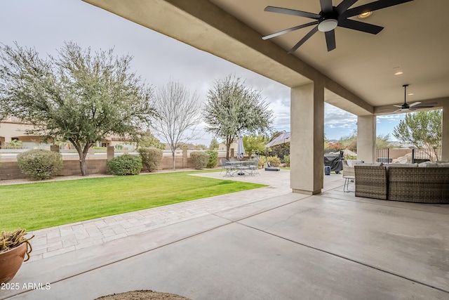 view of patio featuring ceiling fan and an outdoor living space