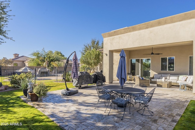 view of patio featuring outdoor lounge area, grilling area, and ceiling fan