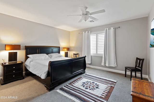 bedroom featuring ceiling fan and carpet