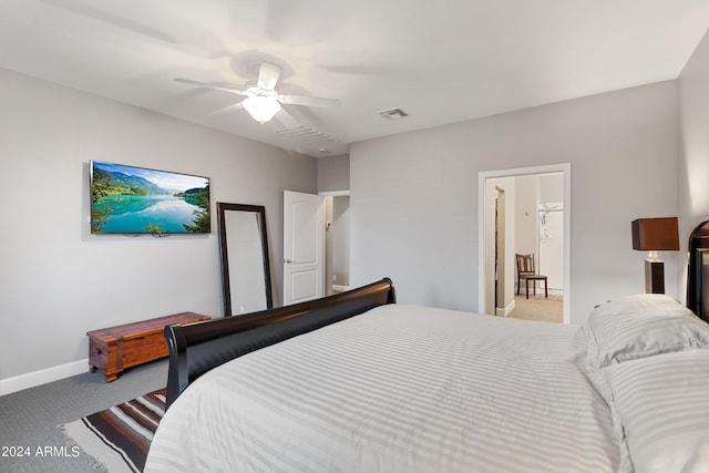 bedroom featuring light carpet and ceiling fan