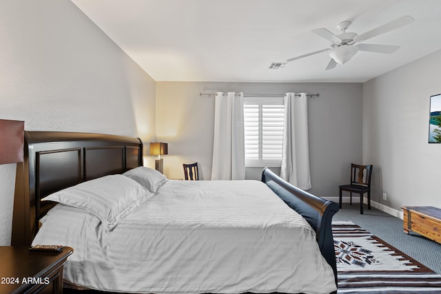 bedroom with ceiling fan and carpet floors