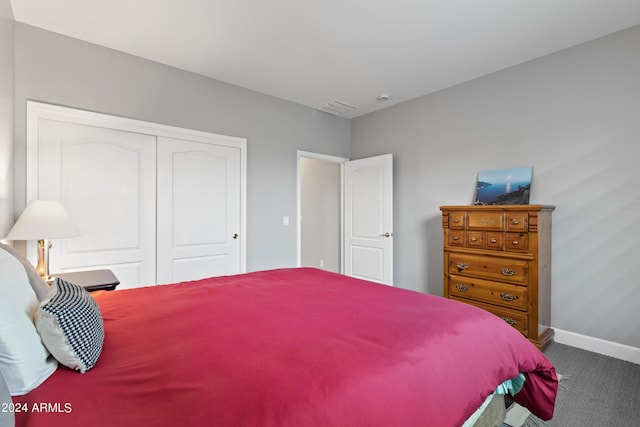 carpeted bedroom featuring a closet